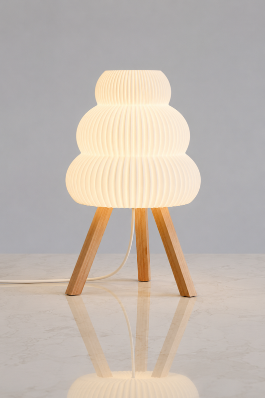 Modern floor lamp with ribbed white shade and wooden legs on a light gray background